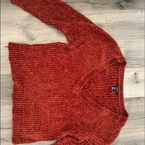 Burnt orange sweater.